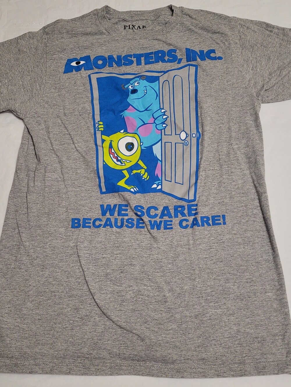 Disney Pixar Monsters Inc We Scare Because We Care T-shirt Mens Small Grey
